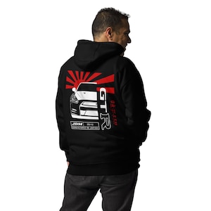 May include: Black hooded sweatshirt featuring a white and red graphic of a Japanese sports car with the text "GT-R" and "JDM" on the back.