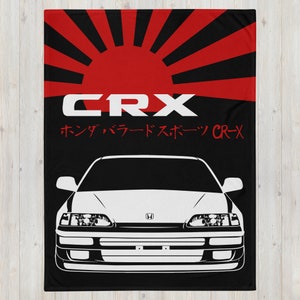 May include: A white Honda CRX with a black background and a red Japanese rising sun graphic. The text "CRX" and "ホンダ・バラードスポーツ CR-X" is in red.