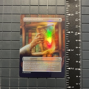 May include: A holographic card titled "Enlightened Tutor" featuring an illustration of a hand holding a glowing book. The card has a bookshelf background and the text "Instant" and instructions below. The artist is Howard Lyon.