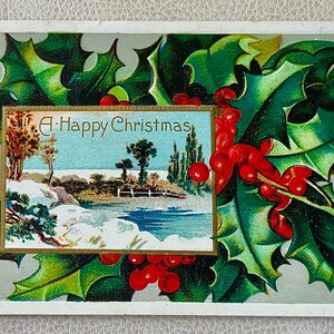Belle carte postale de Noël vintage pittoresque et houx utilisée avec un message mais pas de timbre