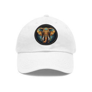 May include: White baseball cap with a round patch featuring a colorful illustration of an elephant's head with intricate details.