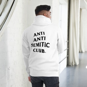 May include: White hooded sweatshirt with black text on the back that reads "ANTI ANTI SEMITIC CLUB."