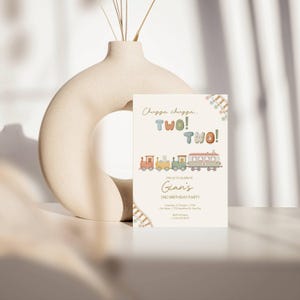 May include: A birthday party invitation with a train theme. The invitation has the text "Chugga chugga. TWO! TWO!" and "Gian's 2nd Birthday Party". The invitation features a colorful train illustration.