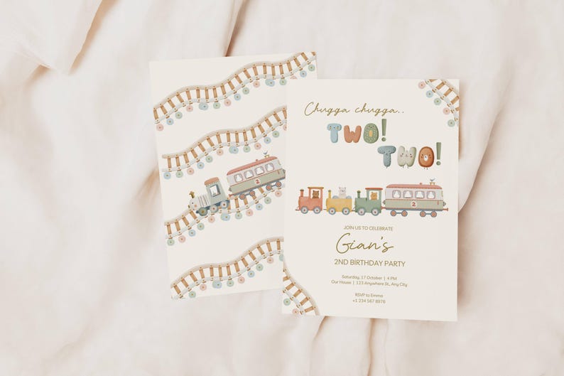 May include: Two birthday party invitations with a train theme. One invitation features a train on tracks with colorful lights. The other invitation says "Chugga chugga... TWO! TWO!" and includes a train illustration. The invitations are cream-colored.
