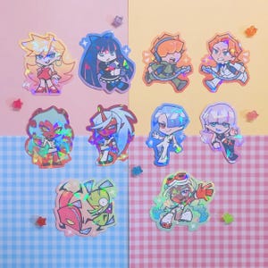 May include: A collection of holographic stickers featuring anime-style characters. The stickers showcase various characters in dynamic poses, with vibrant colors and detailed designs. The background is a mix of pastel colors and a checkered pattern.