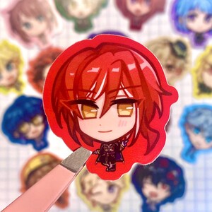 Natsume in focus, background: Tomoya, Nazuna Nito, Hajime Shino, Mitsuru Tenma, Keito Hasumi, Kuro Kiryu, Souma Kanzaki, Tsukasa Suou, Leo Tsukinaga, Izumi Sena, Ritsu Sakuma, Arashi Narukami, Tsumugi Aoba, Sora Harukawa, Madara Mikejima, Anzu