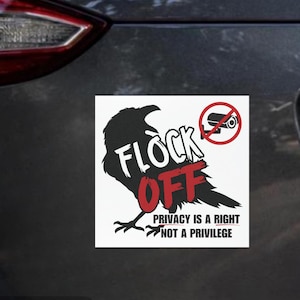 May include: A square car magnet featuring a black silhouette of a crow. The text reads FLOCK OFF in white and red letters. A red circle with a diagonal line crosses out a security camera icon. Below, the text reads PRIVACY IS A RIGHT NOT A PRIVILEGE.