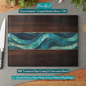 May include: A rectangular chopping board with a dark wood grain design. The centre features a mosaic of blue and teal ocean waves with gold accents. The text "Beautiful Ocean-Inspired / Coastal Kitchen Decor / Gift" is at the top. The bottom text reads "100% Tempered Glass Cutting & Charcuterie Board".