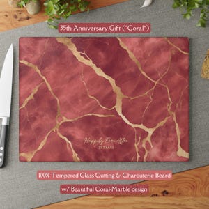 May include: A rectangular tempered glass cutting and charcuterie board with a coral marble design and gold veining. The text "Happily Ever After 35 Years" is displayed. The text "35th Anniversary Gift" is also displayed.