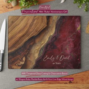 May include: A rectangular tempered glass cutting and charcuterie board featuring a split design of brown wood grain and deep red marble-like resin with gold accents. The board is personalized with the white text Emily & David and 40 Years.