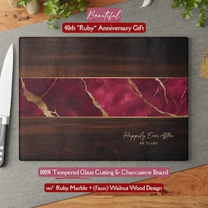 May include: A rectangular cutting board with a dark wood grain design. The center features a ruby marble design with gold veining. Text reads "Happily Ever After 40 YEARS" and "40th Ruby Anniversary Gift".