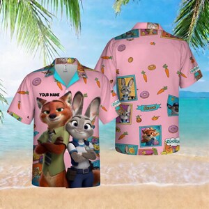 May include: Pink button-up shirt featuring cartoon characters Nick Wilde and Judy Hopps from Zootopia. The shirt has a tropical design with carrots, donuts, and character portraits. The text "YOUR NAME" is printed on the front.