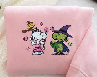Felpa ricamata Snoopy Wicked, Felpa ricamata Wicked For Good, Maglietta Pink Witch Green Witch, Maglietta Changed For Good Wicked