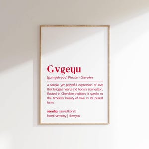 May include: A framed print with a white background and red text. The text defines the Cherokee word "Gvgeyu" as a simple yet powerful expression of love that bridges hearts and honors connection. The text also includes the pronunciation of the word and the phrase "see also: sacred bond | heart harmony | I love you".