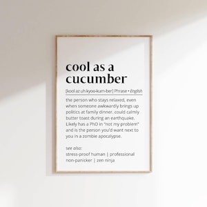 May include: A black and white printable wall art print with the definition of the phrase "cool as a cucumber". The definition describes a person who stays relaxed even in stressful situations. The print also lists synonyms for the phrase, such as "stress-proof human", "professional", "non-panicker", and "zen ninja".