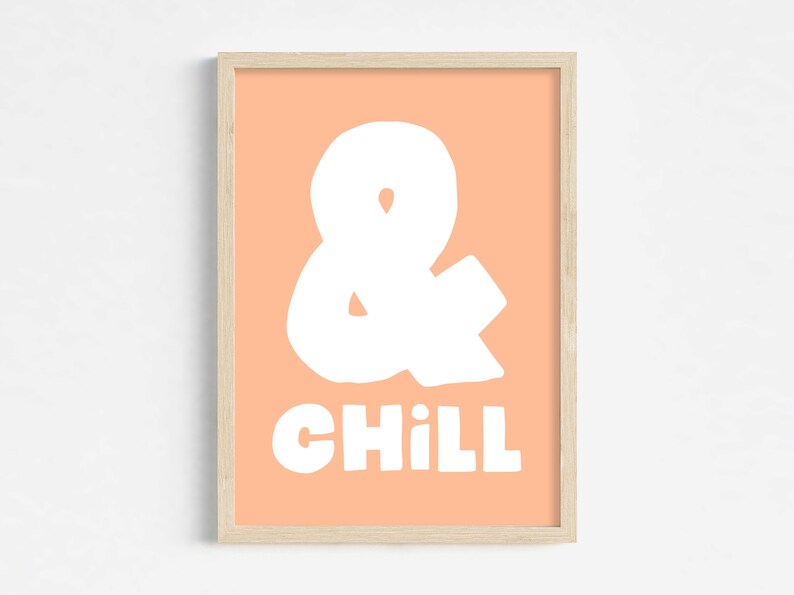 A poster with a peach fuzz pink backgroud and white text in a bold hand written font saying: "& Chill".