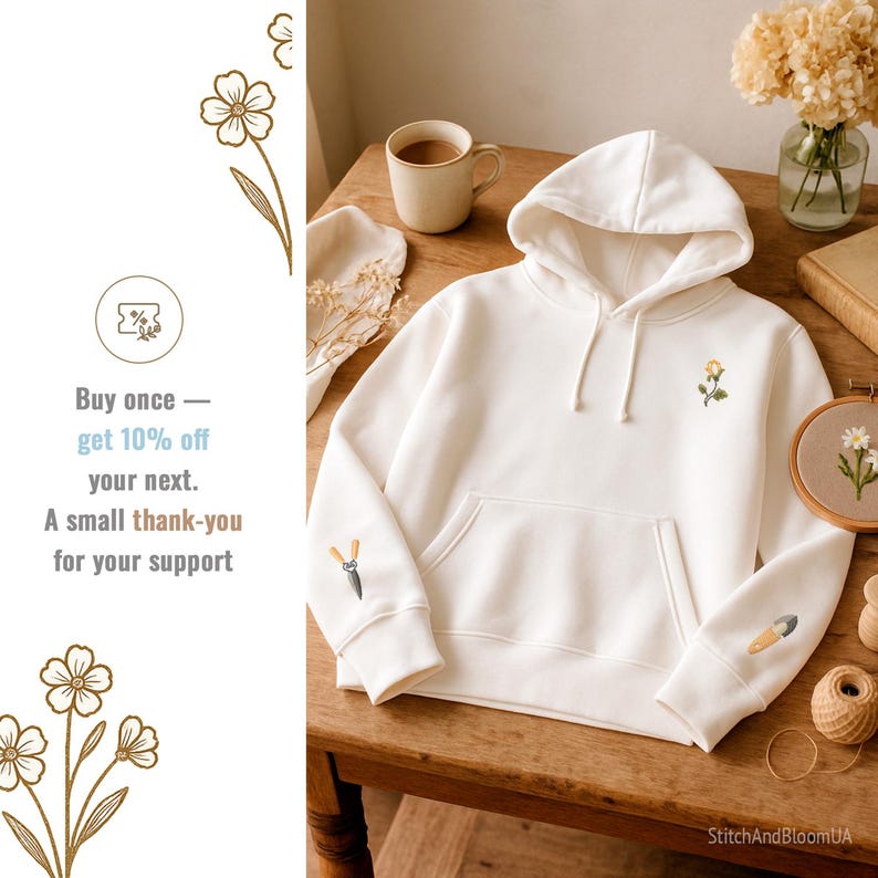 May include: Cream-colored hoodie with a front pocket and embroidered floral details. The left sleeve features a small embroidered pair of shears, and the right sleeve has a trowel. A small flower is embroidered on the chest. The text on the left says "Buy once - get 10% off your next. A small thank-you for your support."