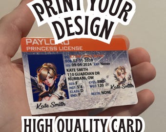 May include: A rectangular plastic identification card titled Payload Princess License with an orange top border. It features a portrait of a blonde character, the name Kate Smith, address 110 Guardian Dr Numbani, OW, and personal details including DOB 07-31-2039.