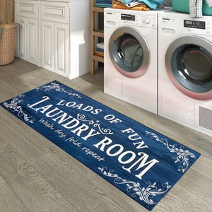 May include: A blue and white laundry room rug with the text "Loads of Fun Laundry Room" and "Wash, dry, fold, repeat".