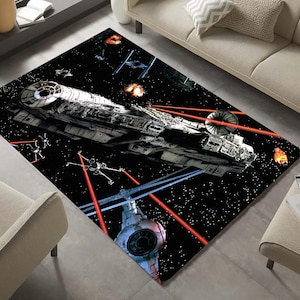 May include: A black and white rug with a space theme. The rug features a spaceship, stars, and red laser beams.