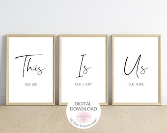 May include: Three printable wall art prints with black calligraphy text on a white background. The prints read "This is Us", "Our Life", "Our Story", "Our Home".