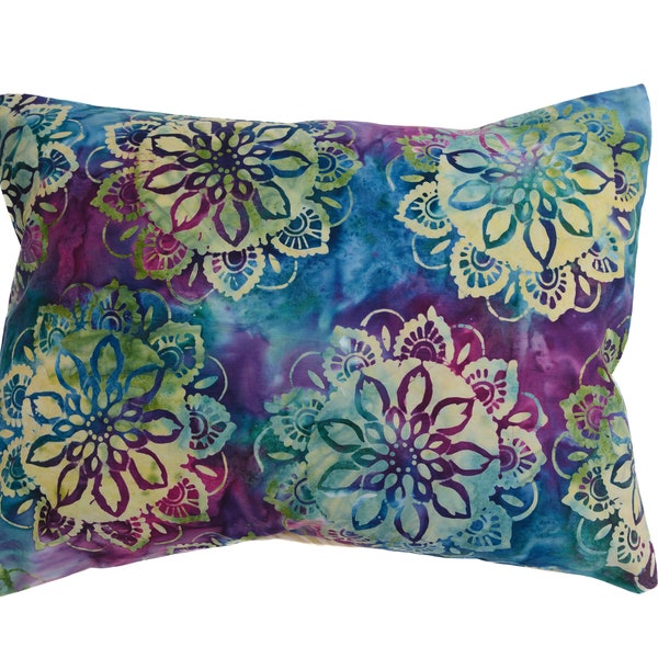 Kaleidoscope. Made with handmade batik fabric. The Puffy Stuffer converts your puffy jacket into a travel or camp pillow.