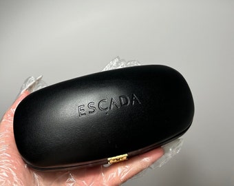 Vintage hard case Escada. Black unisex case for glasses. Gold clap closure, gold inscription inside. Leather case, medium size.