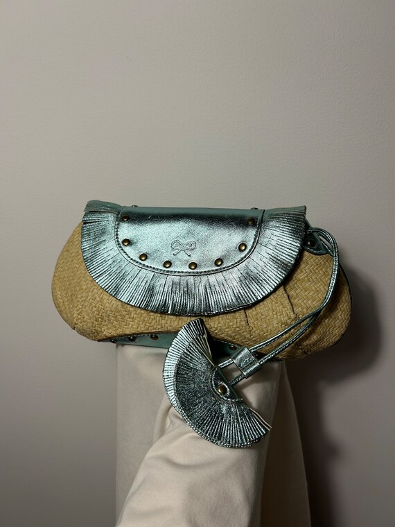 Vintage clutch bag Anya Hindmarch,natural straw woman bag with turquoise  natural leather inserts, suede lining. Attached dangling decoratio