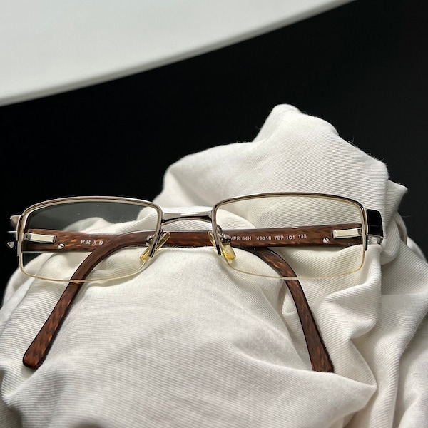 Vintage eyeglasses frame Prada 1990s half rim. Unisex acetate/metal eyeglasses frame rectangle. Brown/bronze color frame with metal inserts.