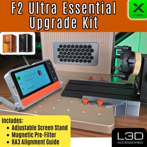 Könnte beinhalten: Gezeigt wird ein F2 Ultra Essential Upgrade Kit mit einstellbarem Bildschirmständer, Magnetvorfilter und RA3-Ausrichtungsführung. Das Kit umfasst einen digitalen Bildschirm mit orangefarbenem Rand, eine schwarz-silberne Basis und eine Wabenlüftung. Der Text "F2 Ultra Essential Upgrade Kit" ist sichtbar.