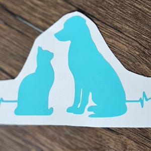 Mooie sticker met hartslag van hond en kat