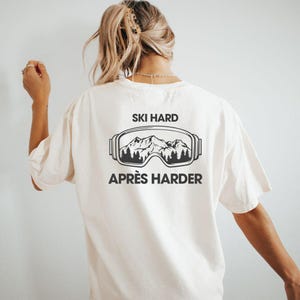 Ski Hard Apres Ski Harder T-Shirt | Funny Ski and Snowboard Shirt Unisex Winter Sports Gift for Ski Trip and Apres Ski Lovers