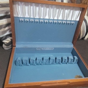 May include: A set of three ceramic mugs with a speckled, matte finish. The mugs are in shades of cream, light gray, and dark gray. Each mug has a simple, minimalist design, perfect for coffee or tea.