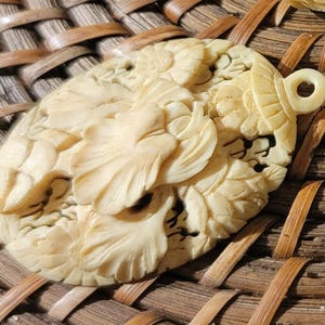 Intricately carved bone pendant, Vintage 1950s bone jewelry