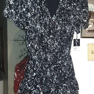 May include: A set of three ceramic mugs with a speckled, matte finish. The mugs are in shades of cream, light gray, and dark gray. Each mug has a simple, minimalist design, perfect for coffee or tea.