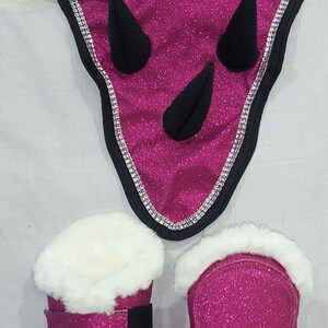 Pink glitter horse fly boots with black straps and white faux fur lining. A pink glitter horse fly bonnet with black ears and rhinestones.