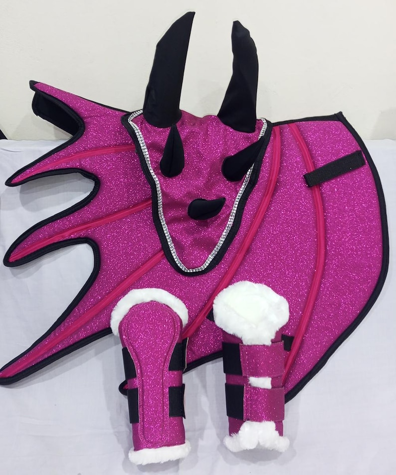 A pink glitter horse fly bonnet with black accents and two matching pink glitter leg wraps with white faux fur lining. christmas gift, easter gift, halloween gift