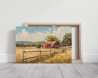 May include: A framed canvas print of a rural landscape featuring a red barn with a wooden fence in a field of tall grass. The sky is blue with fluffy white clouds, and trees are scattered throughout the scene.