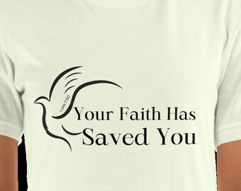 May include: A white t-shirt with a black graphic of a dove with the text "Luke 7:50" and the words "Your Faith Has Saved You".