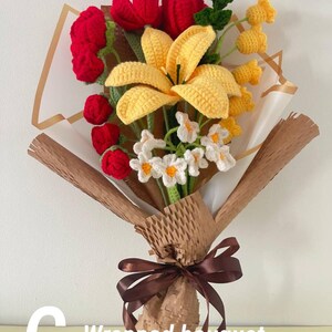 May include: A handcrafted crochet bouquet featuring red tulips, yellow lilies, and small white flowers. The bouquet is wrapped in brown paper and tied with a brown ribbon. The text "C - Wrapped bouquet" is visible.