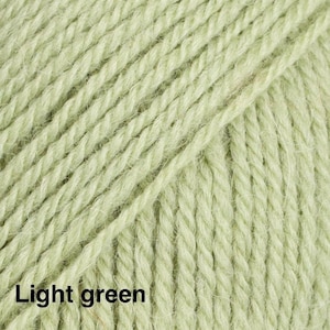 May include: A close-up view of light green yarn featuring a multi-ply twisted fibre construction. The texture shows individual strands of the yarn running diagonally across the frame, with the text Light green printed in the bottom left corner.