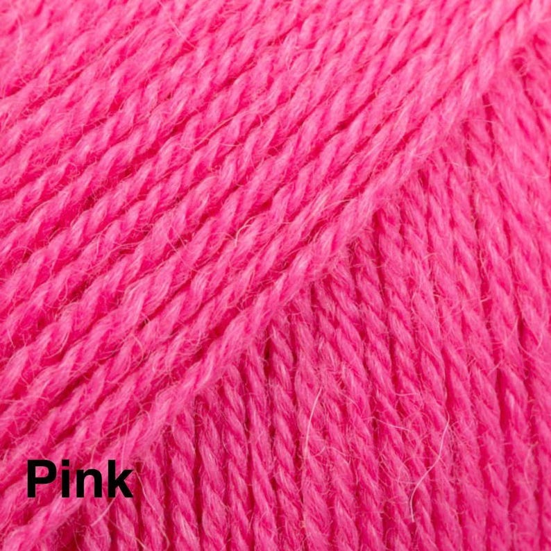 May include: A close-up view of vibrant hot pink yarn featuring a tightly twisted ply construction. The fibres exhibit a soft, fuzzy texture with a consistent saturated colour throughout the entire surface. The word Pink is printed in black.