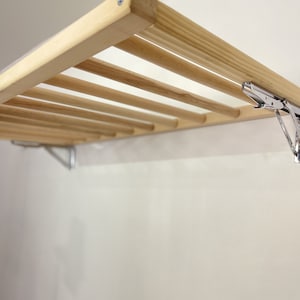 Tendederos de pared y plegables para ropa