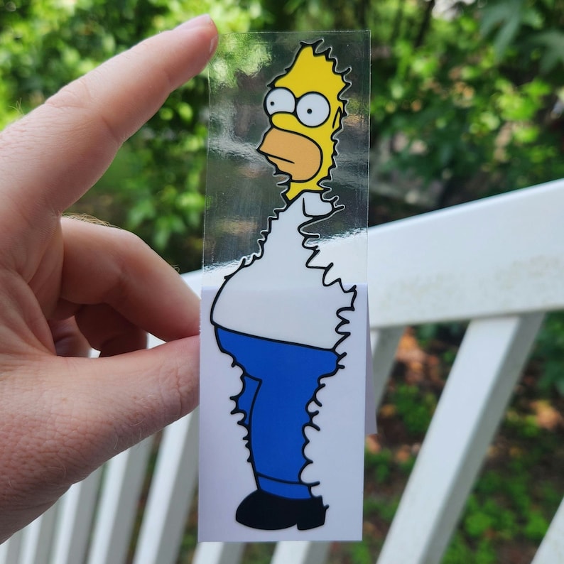 May include: A yellow cartoon character with a white shirt and blue jeans. The character is standing with its arms at its sides. The character is surrounded by a white, jagged border.
