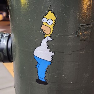 Waterproof Homer decal on a light pole