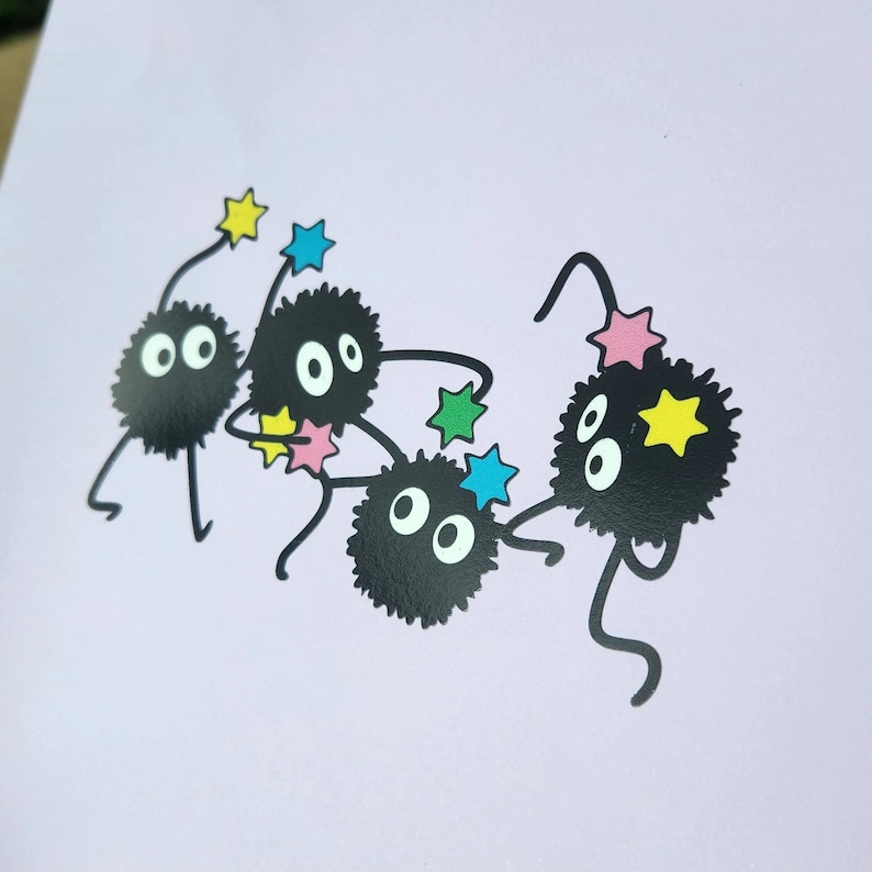 May include: Four black fuzzy creatures with large eyes and small legs are playing with colorful stars. The creatures are on a light purple background.