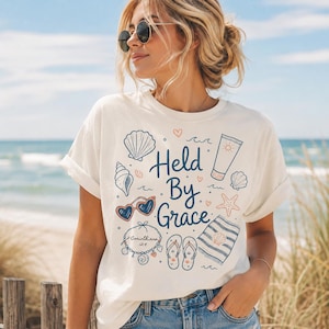 Held By Grace shirt, Christian beach shirt for women, scripture tee, coastal graphic tee, modest faith apparel, summer vacation top