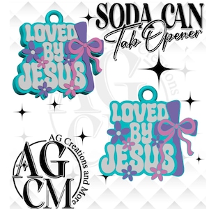 May include: A teal and white soda can tab opener with the words "LOVED BY JESUS" in a retro font. The opener has a purple bow and flowers. The words "SODA CAN Tab Opener" are above the opener.