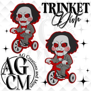 May include: Two identical cartoon-style illustrations of a pale-faced character with black hair, red spiral cheeks, and a red bowtie, wearing a gray suit and riding a red tricycle. The text Trinket Dish and AG Creations and More is visible.