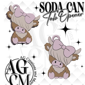 May include: Soda can tab opener featuring a cartoon Highland cow design. The cow is brown and tan with a pink bow and accents. The text "SODA CAN Tab Opener" is above the cow. The logo "AG Creations and More" is also visible.